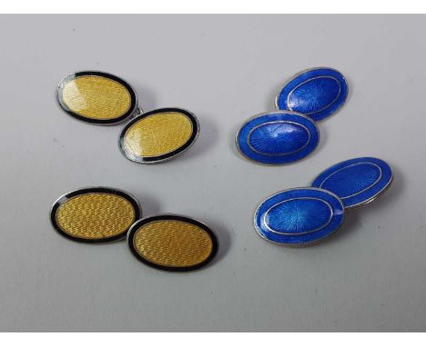 TWO PAIRS OF ART DECO ENGINE TURNED CUFLINKS, one pair in a blue colourway, the other pair in a yellow colourway
