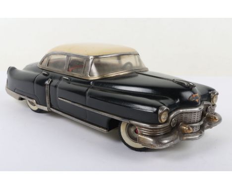 Gama/Joustra tinplate Cadillac, black with cream roof and tin printed interior, 31cm long, generally good condition, friction