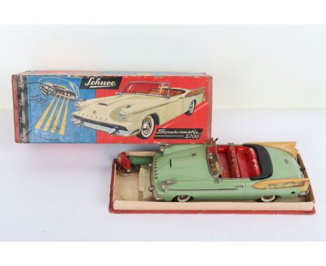 Schuco 5700 Synchromatic battery operated Packard open Tourer, Western Germany circa 1960, light green with red seats, dashbo