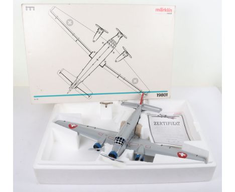 Boxed Marklin 19801 Junkers Ju-52 clockwork tinplate Swiss Airways Passenger airplane, silver, boxed with key, leaflet, paper