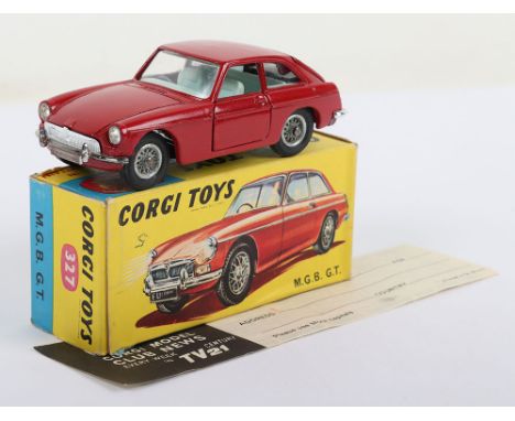 Vintage Corgi Toys 327 M.G.B G.T. red body, light blue interior, jewelled headlights, spoked wheel hubs, suitcase, in near mi