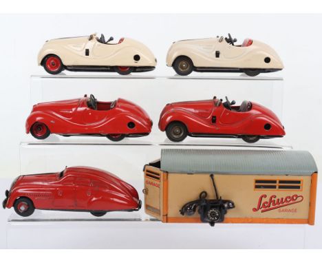 Three Schuco Examico 4001 Cars, tinplate bodies, one complete with windscreen, Akustico 2002, red body, Commando red tinplate