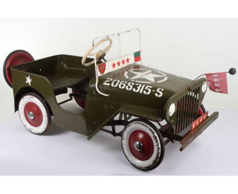 A Tri-ang pressed steel Willys General Jeep child’s Pedal car, English 1960s, original military green body, numbered 2068315-