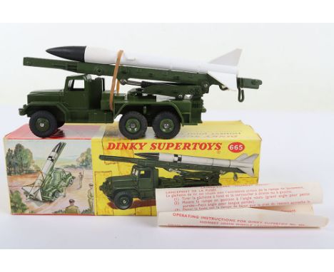 Dinky Supertoys 665 Honest John Missile Launcher, military green body, with original missile, instruction leaflet, in mint or