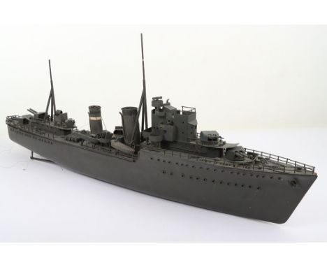 A Bassett-Lowke style scale model of a Royal Navy Destroyer, hand carved grey painted hull and wood decks with metal and tinp