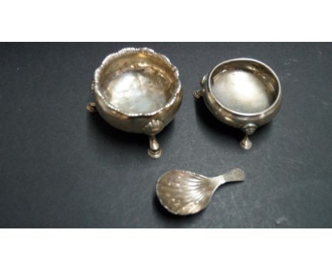 Two antique silver salts; together with a George III silver caddy spoon, by T.N, having shell bowl and bright cut handle, 126