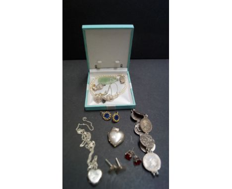 A carved jade pendant on silver chain; together with a selection of silver jewellery items.