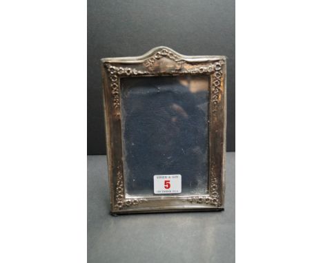 A silver photograph frame, by K F Ltd, London 1984, 18cm.