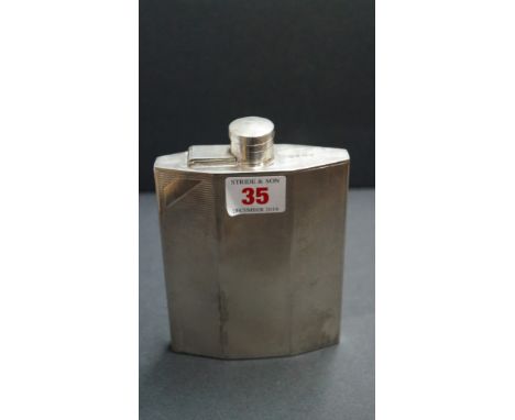 An engine turned silver hip flask, Birmingham 1929, 14.5cm, 201g all in. Condition Report: marks rubbed. several areas of sol