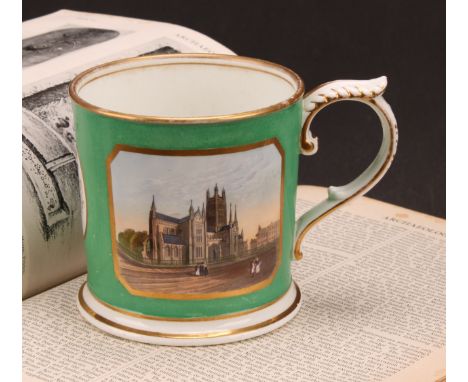 An English porcelain porter mug, painted with a view of Worcester Cathedral, within a gilt border on a pale green ground, flo