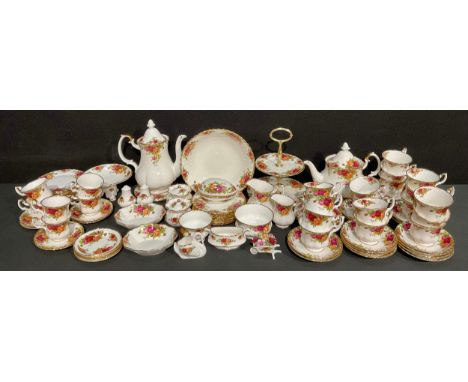 A Royal Albert Old Country Roses pattern dinner and tea service, including teapot on stand, coffee pot, milk and cream jugs, 