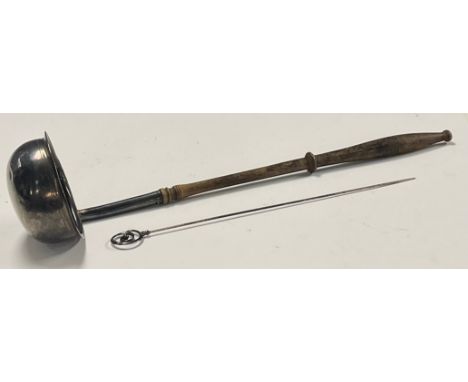 An 18th century silver toddy ladle, turned treen handle, dished bowl with indistinct marks, 33cm; an Edwardian silver hat pin