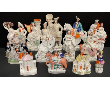 A collection of Victorian Staffordshire flatbacks, including A Soldier's Dream, Robin Hood, shepherdess with harp, maiden wit