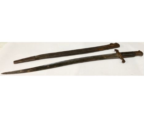 A British Martini Henry 1860 Pattern Bayonet with 578mm single edged fullered blade, marked "Chavassh", crossguard dented bac