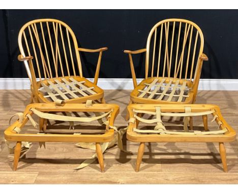A pair of Ercol 203 armchair frames, each with conforming foot stool frame, unbadged (4) 