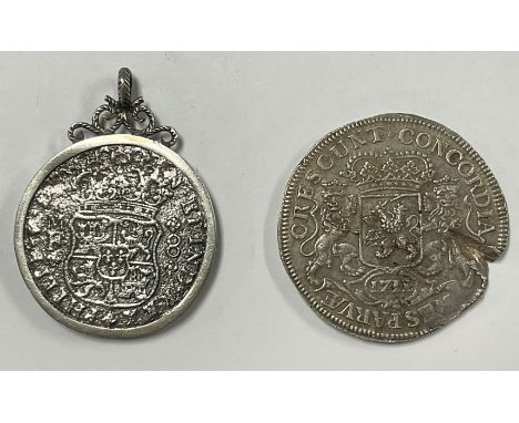 Numismatics - an 18th century Spanish dollar (pieces of eight), the mount engraved TREASURE FROM 'HOLLANDIA' SUNK 1743 STERLI