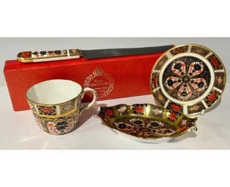 A Royal Crown Derby 1128 Imari pattern shaped oval trinket dish, solid gold band, second quality; a 1128 circular trinket dis