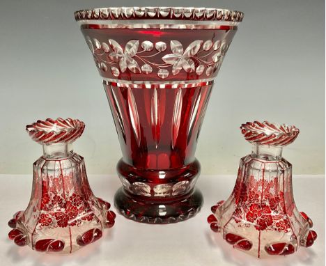 A large Bohemian ruby flashed tapering cylindrical vase, 23cm; a pair of Bohemian ruby flashed scent bottles, lacking stopper