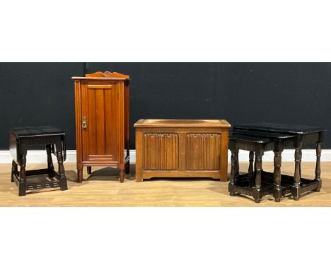 An Edwardian bedroom cabinet, 87cm high, 39.5cm wide, 35.5cm deep; a linenfold blanket chest, of small proportions, 46cm high