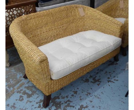 CONSERVATORY WICKER SOFA, rounded back on splayed legs, with cushion 78cm H x 138cm x 89cm and chair to match 79cm H x 81cm. 