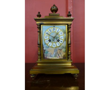 A 19th Century French gilt metal mantel clock, with painted porcelain panels, 35cns h 
