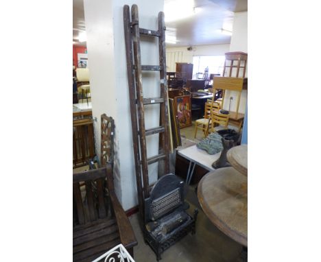A pine extending ladder and an electric fire 