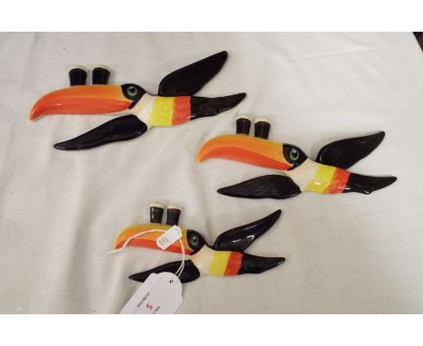 Three Carlton ware Guinness flying toucans, marks to base  Large - crazing to body, firing fault to 'My Guiness' glassMedium 