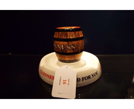 A vintage Guinness ceramic barrel advertising ashtray, marks to base Rgd. No 778941
