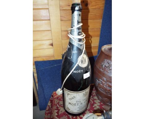 A large Dry Imperial Moet & Chandon bottle converted to a lamp