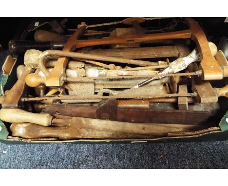 A box of vintage tools to include fret-saws, drills etc