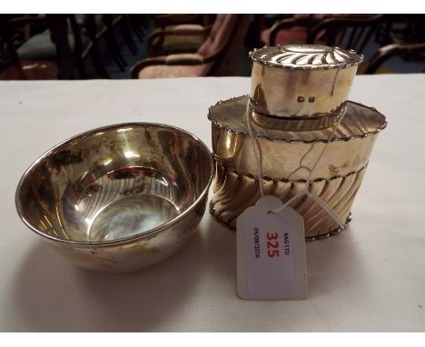 A Birmingham 1895 silver caddy with fluted decoration and a Chester silver bowl