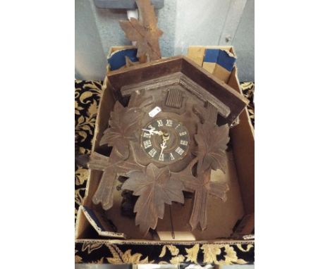 A 20thC Black Forest cuckoo clock with two train weight driven movement  
