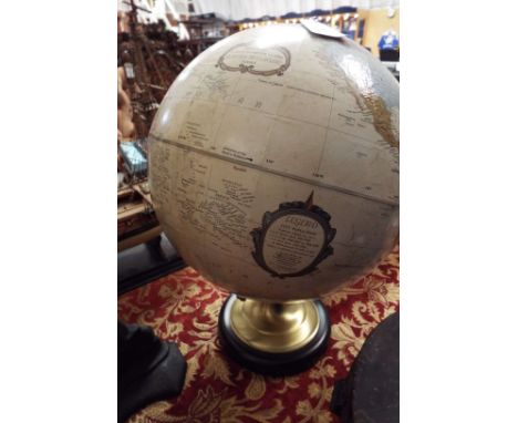 A vintage globe on metal stand