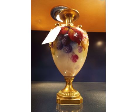 A Royal Worcester two-handled urn with hand painted blackberry and foliate decoration by Kitty Blake, the handles, pedestal b