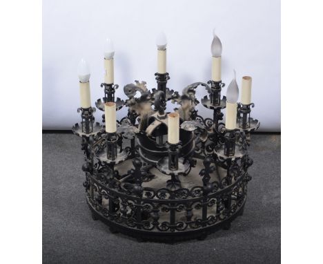 19th Century iron and steel ceiling light, the main ring with bold scroll and leaf design, eight lights. diameter 56cm, with 
