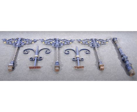 Small section of cast iron railing/bannister, comprising end post, three support brackets and two scrolled inserts.