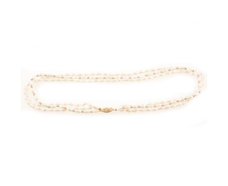 A freshwater pearl three string choker, the pearls on one string spaced by small round golden beads, 42cm, filigree clasp mar