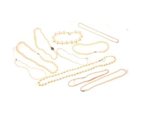 A necklace of fifty-seven baroque simulated pearls, cream colour, silk cord knotted every pearl, 83cm; a 1920s necklet of for