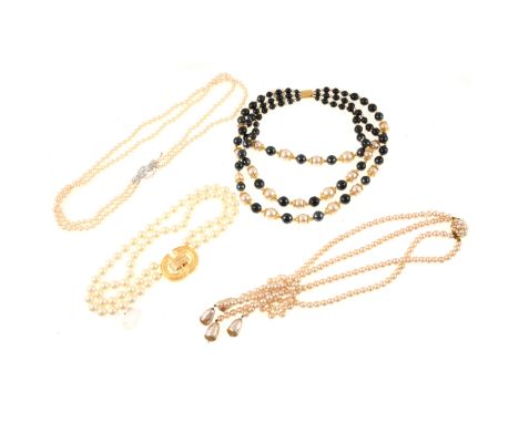 An Art Deco three-strand simulated graduated pearl necklace, paste set clasp marked 'sterling', smallest strand 54cm; a two-s