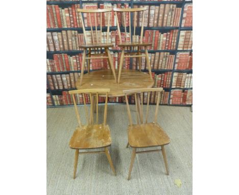 An Ercol light elm table (H73xL98xW90cm) and four chairs