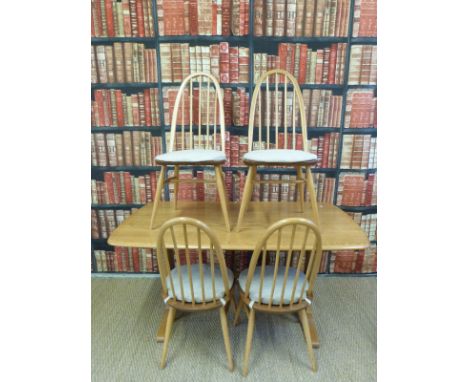 An Ercol light elm table with refectory style supports and four chairs (H72xL153xW85cm)