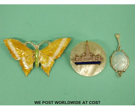 A silver butterfly brooch set with enamel, brooch and an enamel pendant 