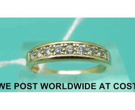 A 9ct gold ring set with nine diamonds (size M)