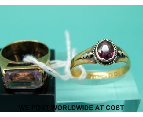 A 22ct gold ring set with a garnet (size P) and a 9ct gold ring set with amethyst (size J)