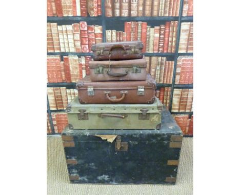 A metal bound steamer trunk and four vintage pieces of luggage (trunk H48xL84XW51)