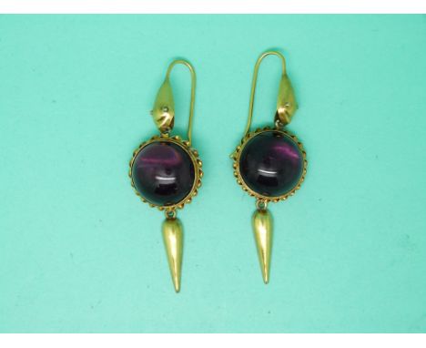 A pair of Victorian yellow metal earrings set with a large amethyst cabochon to each 