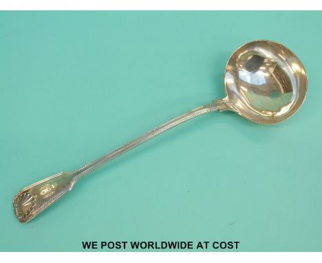 A Victorian hallmarked silver fiddle thread and shell pattern ladle, length 34cm, London 1855 maker George W Adams (292g)