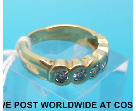 A white metal ring marked 14k set with six diamonds each measuring approximately 0.15ct. (size R) 