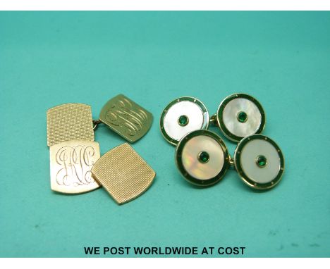 A pair of 9ct gold cufflinks set with mother of pearl surrounded by green enamel with green stones to the centre together wit