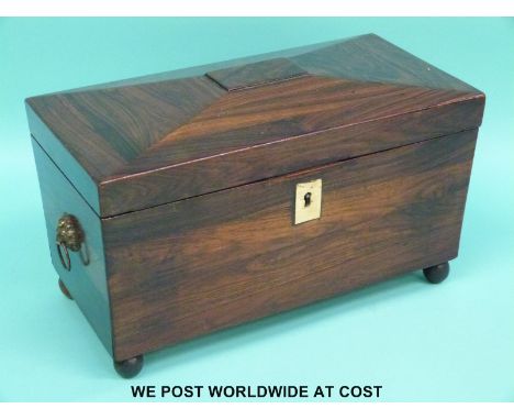 A rosewood or similar exotic wood tea caddy with two divisions flanking a mixing bowl (W30xD16xH18cm)